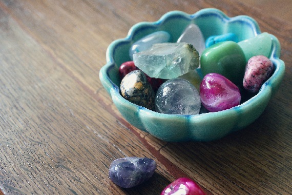 a bowl of colorful stones and gems