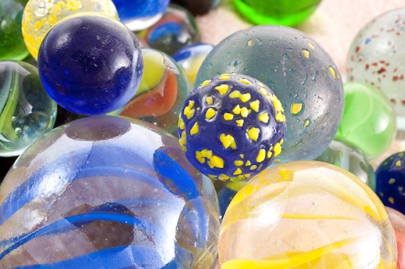 glass balls in many sizes, colors and textures in a pile